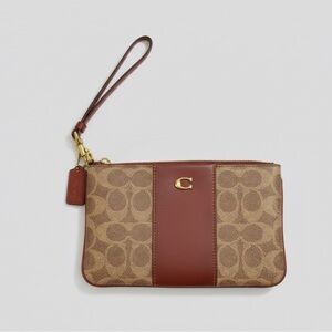 Coach Signature Burnt Orange and Tan Wristlet